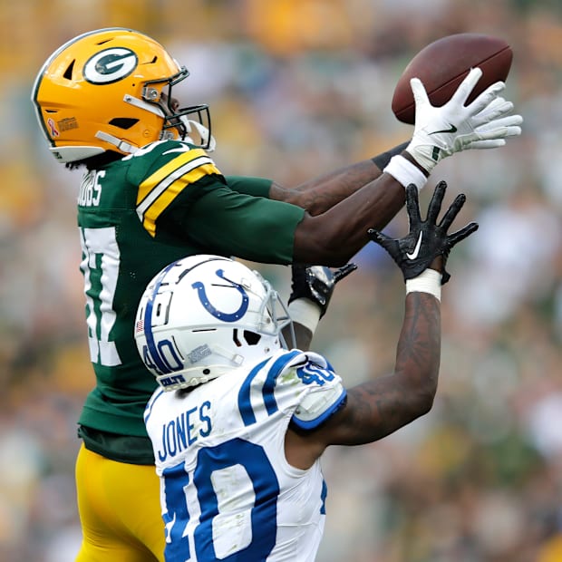 Green Bay Packers wide receiver Romeo Doubs (87) pulls down a catch against Indianapolis Colts cornerback Jaylon Jones.