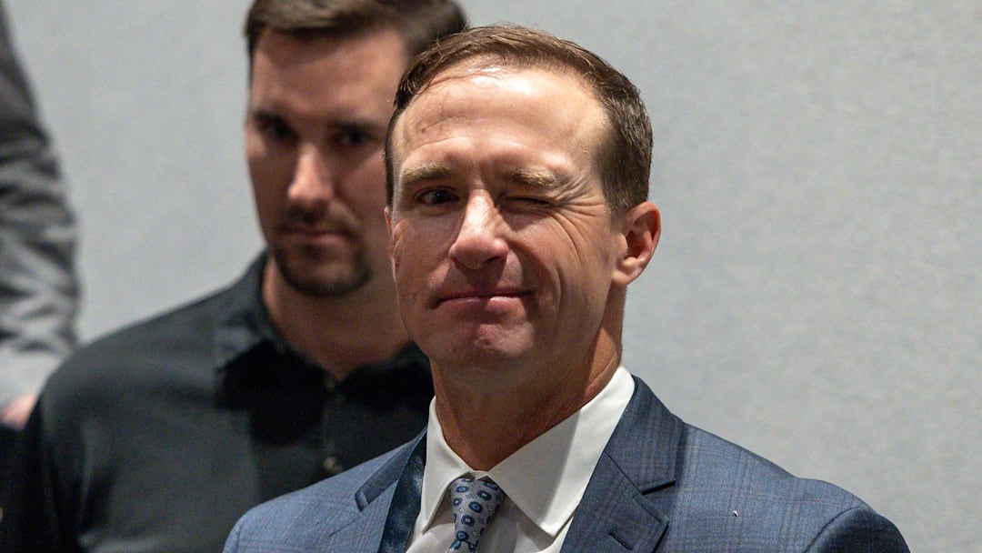 New Orleans Saints former quarterback Drew Brees winks to the media