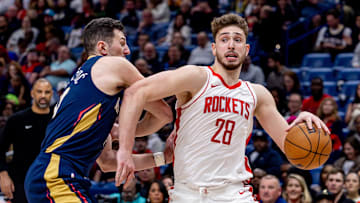 Mar 6, 2025; New Orleans, Louisiana, USA;  Houston Rockets center Alperen Sengun (28) dribbles against New Orleans Pelicans center Karlo Matkovic (17) during the second half at Smoothie King Center. Mandatory Credit: Stephen Lew-Imagn Images
