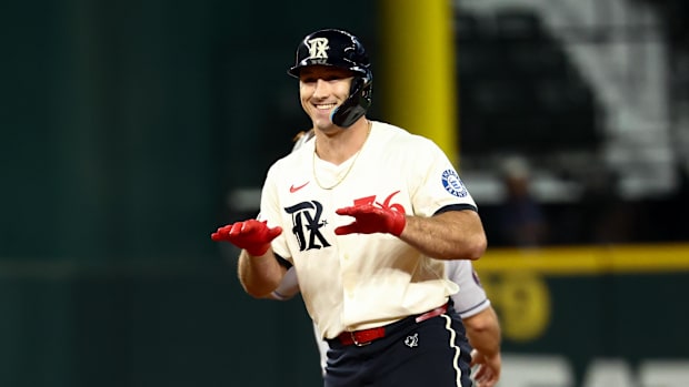 Texas Rangers left fielder Wyatt Langford reacts after hitting a double during the first inning against the Houston Astros