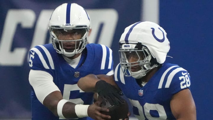 Indianapolis Colts quarterback Anthony Richardson (5) hands the ball off to running back Jonathan Taylor (28) during a preseason game Sunday, Aug. 11, 2024, at Lucas Oil Stadium in Indianapolis.