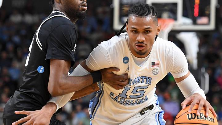 VCU Rams forward Barry Evans (5) defends North Carolina Tar Heels forward Jarin Stevenson (15) Thursday, March 19, 2026, during the NCAA Men’s Basketball Tournament first round game at Bon Secours Wellness Arena in Greenville, South Carolina.