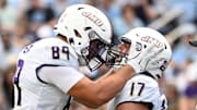 Sep 21, 2024; Chapel Hill, North Carolina, USA; James Madison Dukes tight end Taylor Thompson (17) reacts with tight end Josh Phifer (89) after scoring a touchdown in the second quarter at Kenan Memorial Stadium. Mandatory Credit: Bob Donnan-Imagn Images