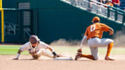 Jun 19, 2022; Omaha, NE, USA; Texas A&M Aggies center fielder Jordan Thompson (31) steals second against Texas Longhorns shortstop Trey Faltine (0) during the seventh inning at Charles Schwab Field. Mandatory Credit: Dylan Widger-USA TODAY Sports