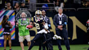Oct 13, 2024; New Orleans, Louisiana, USA; New Orleans Saints wide receiver Rashid Shaheed (22) returns a punt for a touchdown during the second quarter against the Tampa Bay Buccaneers at Caesars Superdome. 