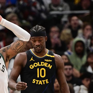 Feb 10, 2025; Milwaukee, Wisconsin, USA; Milwaukee Bucks guard Damian Lillard (0) reacts after a foul call in the third quarter against the Golden State Warriors at Fiserv Forum. Mandatory Credit: Benny Sieu-Imagn Images