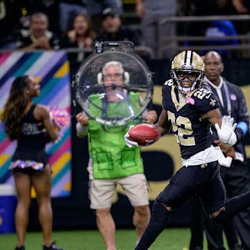 Oct 13, 2024; New Orleans, Louisiana, USA; New Orleans Saints wide receiver Rashid Shaheed (22) returns a punt for a touchdown during the second quarter against the Tampa Bay Buccaneers at Caesars Superdome. 