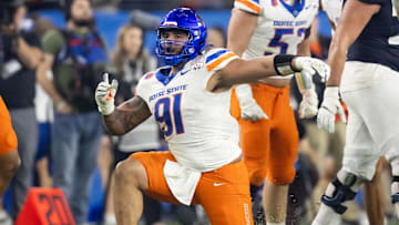 Dec 31, 2024; Glendale, AZ, USA; Boise State Broncos defensive end Ahmed Hassanein (91) celebrates a play against the Penn State Nittany Lions during the Fiesta Bowl at State Farm Stadium. Mandatory Credit: Mark J. Rebilas-Imagn Images