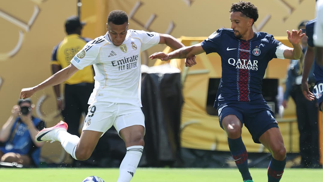 Jul 9, 2025; East Rutherford, New Jersey, USA; Real Madrid CF forward Kylian Mbappe (9) plays the ball against Paris Saint-Germain defender Marquinhos (5)