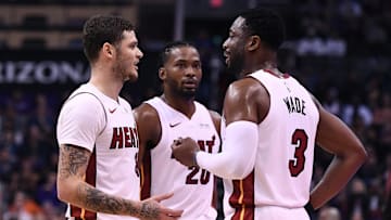 Dec 7, 2018; Phoenix, AZ, USA; Miami Heat guard Dwyane Wade (3) talks with guard Tyler Johnson (8) in the game against the Phoenix Suns at Talking Stick Resort Arena. Mandatory Credit: Jennifer Stewart-Imagn Images