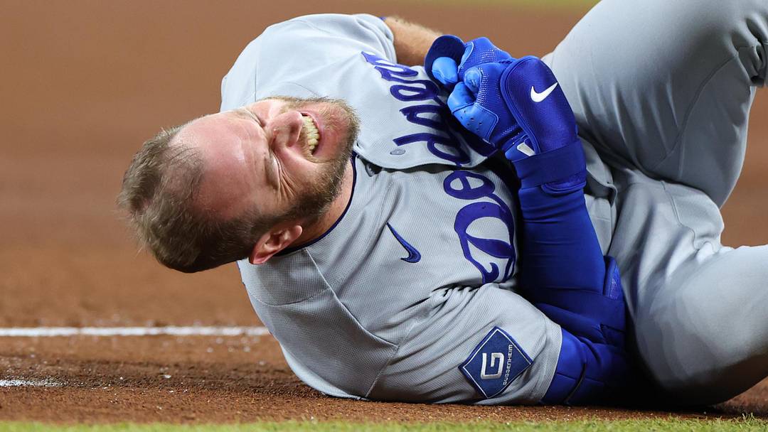 Los Angeles Dodgers third baseman Max Muncy (13) reacts