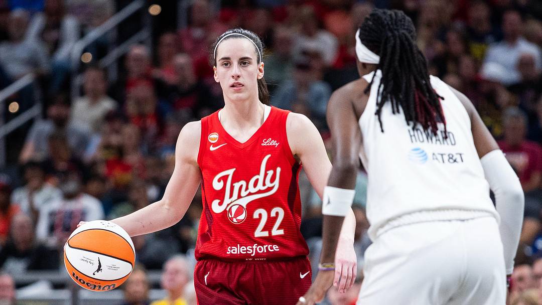 Indiana Fever guard Caitlin Clark (22) dribbles against Atlanta Dream guard Rhyne Howard (10) Indiana Fever guard Caitlin Clark (22) dribbles against Atlanta Dream guard Rhyne Howard (10)