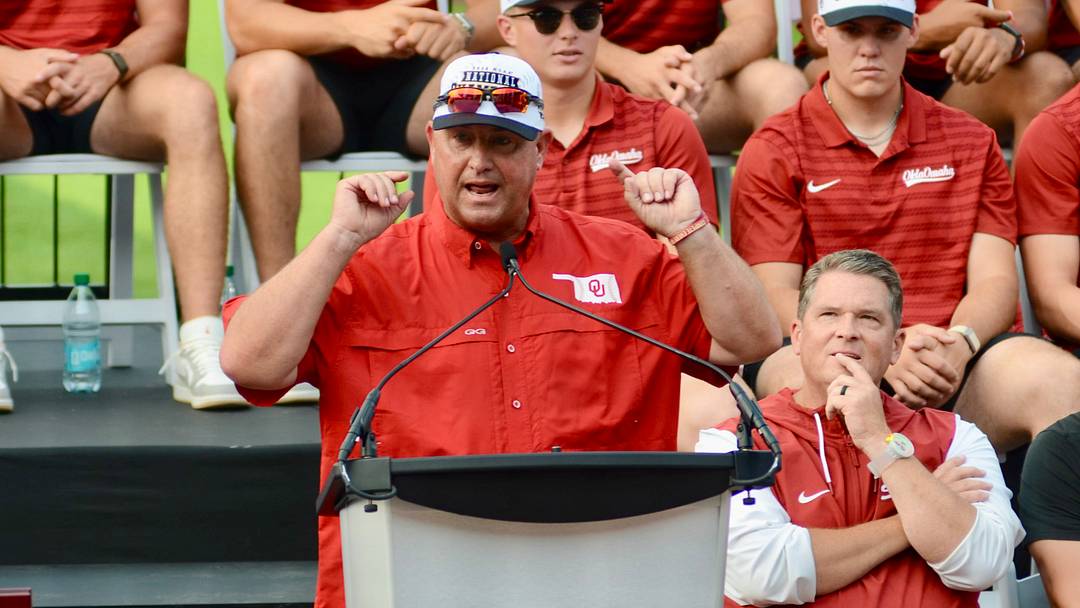 Oklahoma coach Skip Johnson addresses the crowd at Kimrey Family Stadium at the Sooners' national championship celebration event.