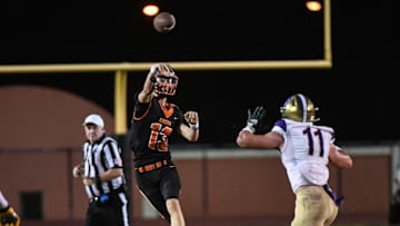 Brady Hart of Cocoa passes over Hunter Zirkle of Booker in the FHSAA football Class 2S state semifinal Friday, December 1, 2023.