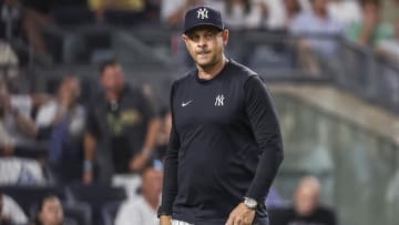 Jun 22, 2024; Bronx, New York, USA;  New York Yankees manager Aaron Boone (17) walks off the field after being ejected in the seventh inning against the Atlanta Braves at Yankee Stadium. Mandatory Credit: Wendell Cruz-USA TODAY Sports