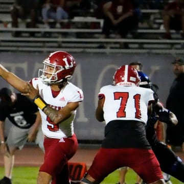 Orange Lutheran Lancers quarterback TJ Lateef (9) throws a pass against the Chandler Wolves during a football game at Chandler High in Chandler on Sept. 8, 2023.