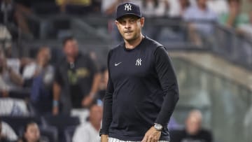 Jun 22, 2024; Bronx, New York, USA;  New York Yankees manager Aaron Boone (17) walks off the field after being ejected in the seventh inning against the Atlanta Braves at Yankee Stadium. Mandatory Credit: Wendell Cruz-USA TODAY Sports