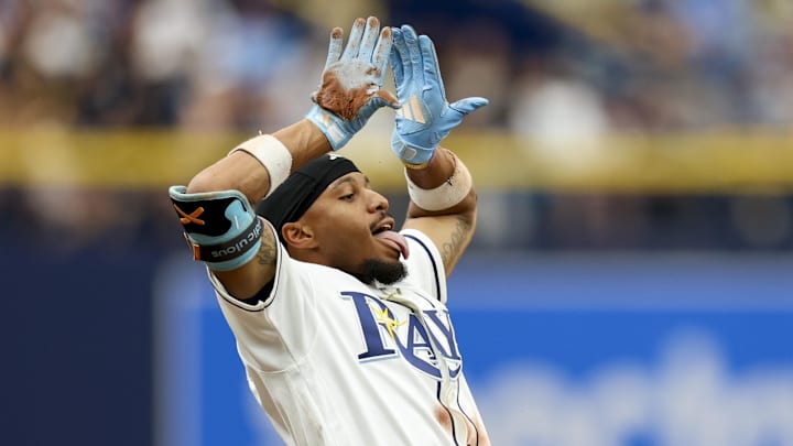 Apr 12, 2026; St. Petersburg, Florida, USA; Tampa Bay Rays left fielder Chandler Simpson (14) reacts after hitting a triple against the New York Yankees in the seventh inning at Tropicana Field. Mandatory Credit: Nathan Ray Seebeck-Imagn Images