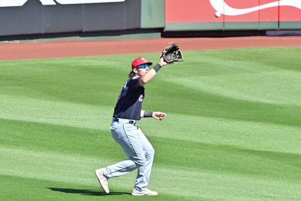 Chase DeLauter catches a fly ball