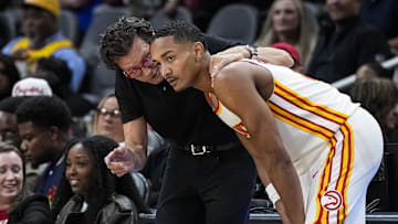 Atlanta Hawks head coach Quin Snyder talks to guard Kobe Bufkin during the game against the Cleveland Cavaliers during the second half