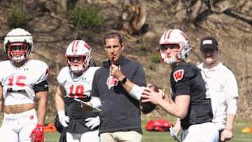 Wisconsin coach Luke Fickell watches as quarterback Mabrey Mettauer throws a pass during practice just outside Camp Randall Stadium in Madison, Wisconsin on Saturday April 7, 2024.