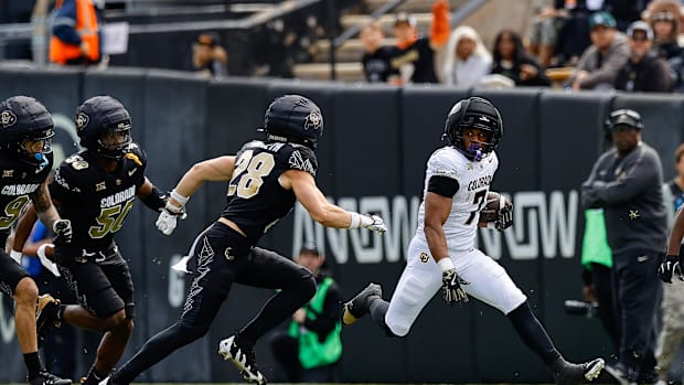 Apr 19, 2025; Boulder, CO, USA; Colorado Buffaloes running back Dallan Hayden (7) and safety Ben Finneseth (28) during the sp