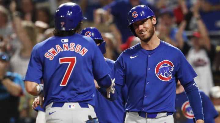 Aug 26, 2024; Pittsburgh, Pennsylvania, USA;  Chicago Cubs right fielder Cody Bellinger (24) greets shortstop Dansby Swanson (7) crossing home plate on a grand slam home run against the Pittsburgh Pirates during the sixth inning at PNC Park.