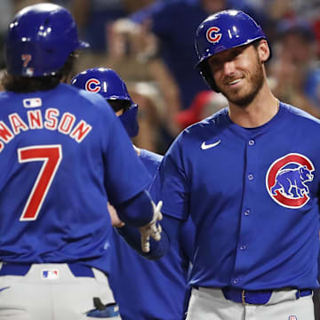 Aug 26, 2024; Pittsburgh, Pennsylvania, USA;  Chicago Cubs right fielder Cody Bellinger (24) greets shortstop Dansby Swanson (7) crossing home plate on a grand slam home run against the Pittsburgh Pirates during the sixth inning at PNC Park.