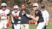 Wisconsin coach Luke Fickell watches his quarterbacks throw passes during practice just outside Camp Randall Stadium in Madison, Wisconsin on Saturday April 7, 2024.