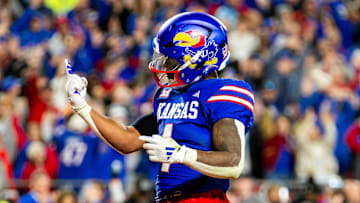 Nov 23, 2024; Kansas City, Missouri, USA;  Kansas running back Devin Neal (4) gestures after scoring a touchdown during the 4th quarter between the Kansas Jayhawks and the Colorado Buffaloes.