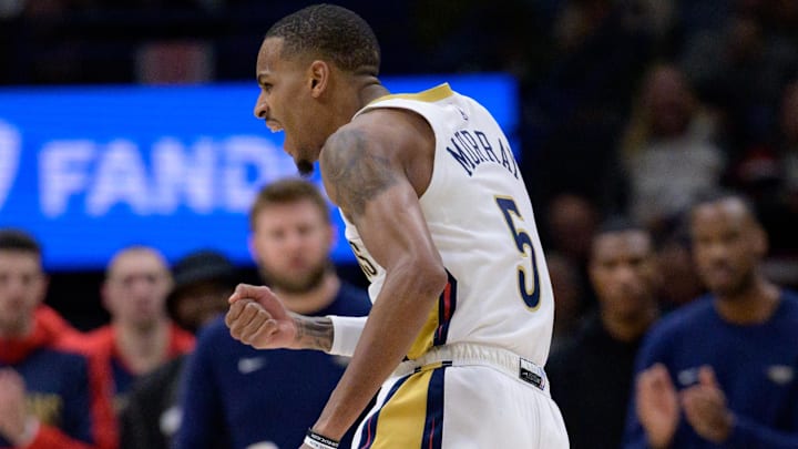 Jan 15, 2025; New Orleans, Louisiana, USA; New Orleans Pelicans guard Dejounte Murray (5) reacts after making a basket late in the fourth quarter against the Dallas Mavericks at Smoothie King Center. Mandatory Credit: Matthew Hinton-Imagn Images