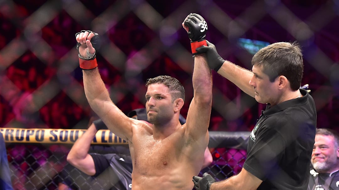 Jan 21, 2023; Rio de Janeiro, Brazil; Thiago Moises (red gloves) reacts after the fight against Melquizael Costa (blue gloves) during UFC 283 at Jeunesse Arena. Mandatory Credit: Jason da Silva-USA TODAY Sports