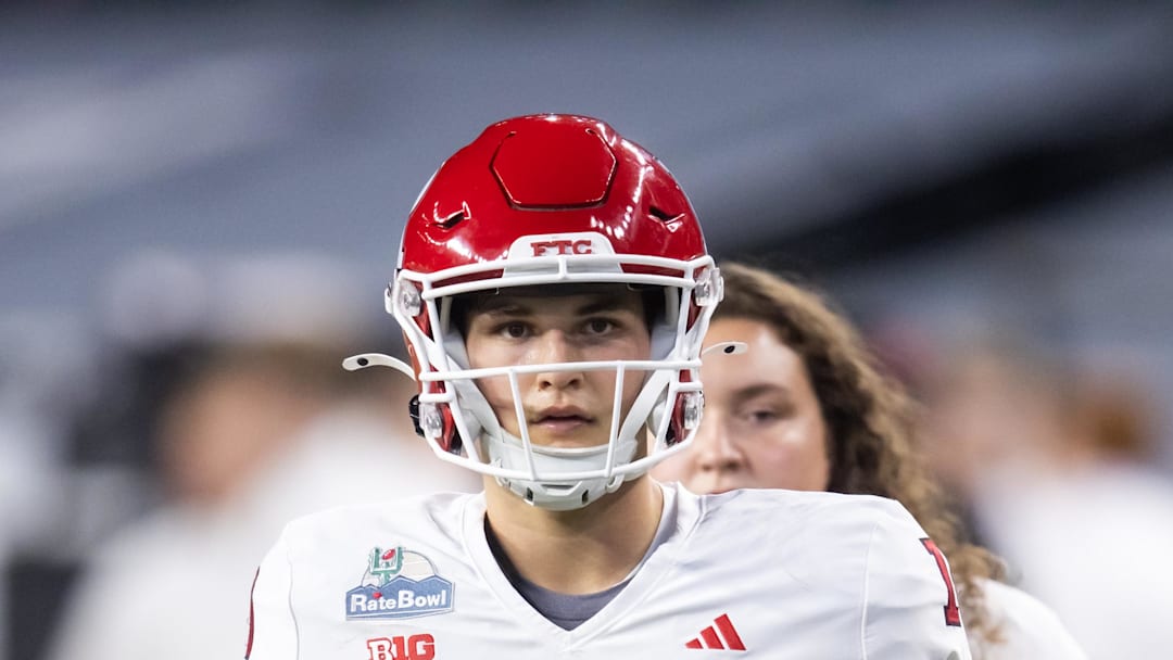 Dec 26, 2024; Phoenix, AZ, USA; Rutgers Scarlet Knights quarterback AJ Surace (10) against the Kansas State Wildcats during the Rate Bowl at Chase Field. Mandatory Credit: Mark J. Rebilas-Imagn Images
