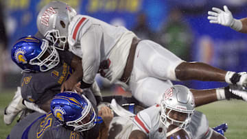 San Jose State Spartans tight end Jacob Stewart (81) and UNLV Rebels linebacker Marsel McDuffie (8) try to get their hands on the ball during the third quarter at CEFCU Stadium. The initial call of a fumble was overturned on video replay. Mandatory Credit: D. Ross Cameron-Imagn Images