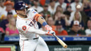 Jun 23, 2024; Houston, Texas, USA; Houston Astros designated hitter Yainer Diaz (21) hits a RBI sacrifice against the Baltimore Orioles in the fourth inning at Minute Maid Park.