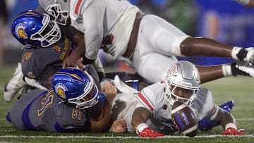 UNLV linebacker Marsel McDuffie reaches for the ball.