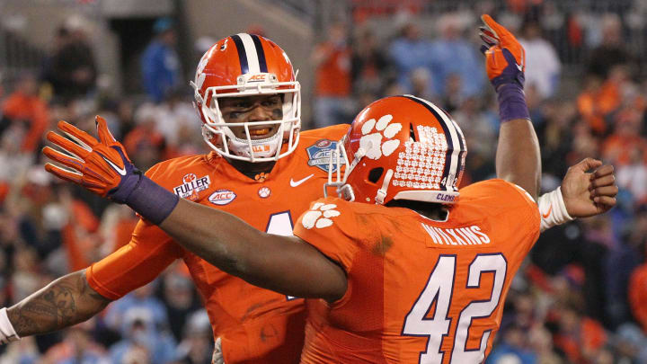 Clemson quarterback Deshaun Watson (4) celebrates with teammate Clemson defensive lineman Christian Wilkins (42) during the fourth quarter of the ACC Championship game in Charlotte, North Carolina.