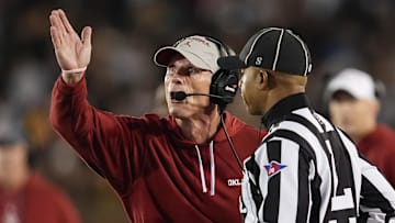 Oklahoma Sooners head coach Brent Venables talks with line judge Jeremiah Harris during the first half against the Missouri Tigers at Faurot Field at Memorial Stadium last season.