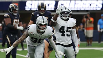 Nov 30, 2025; Inglewood, California, USA; Las Vegas Raiders defensive end Maxx Crosby (98) reacts after a tackle against the Los Angeles Chargers during the second half at SoFi Stadium. Mandatory Credit: Kiyoshi Mio-Imagn Images