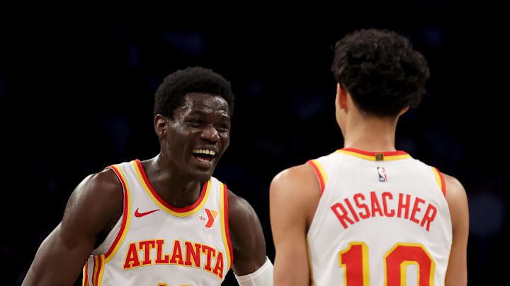 Atlanta Hawks forward Mouhamed Gueye celebrates with forward Zaccharie Risacher during the second quarter against the Brooklyn Nets at Barclays Center.