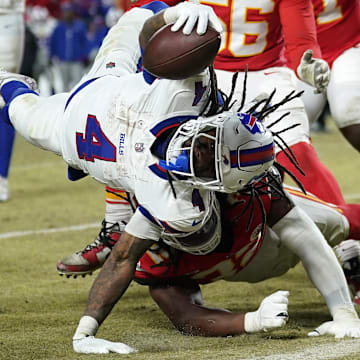 Jan 26, 2025; Kansas City, MO, USA; Buffalo Bills running back James Cook (4) dives for a touchdown against the Kansas City Chiefs during the second half in the AFC Championship game at GEHA Field at Arrowhead Stadium. Mandatory Credit: Denny Medley-Imagn Images