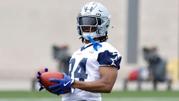 Jun 10, 2025; Arlington, TX, USA; Dallas Cowboys running back Jaydon Blue (34) goes through a drill during practice at the Ford Center at the Star Training Facility in Frisco, Texas. Mandatory Credit: Chris Jones-Imagn Images