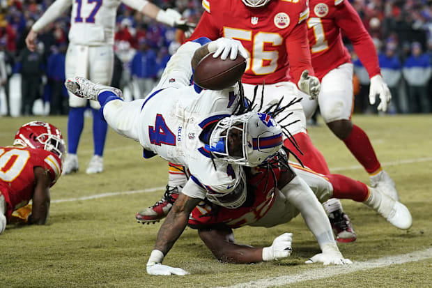 Buffalo Bills running back, James Cook, scores a touchdown against the Kansas City Chiefs. Buffalo Bills running back, James Cook, scores a touchdown against the Kansas City Chiefs.