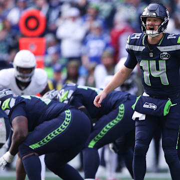 Nov 9, 2025; Seattle, Washington, USA; Seattle Seahawks quarterback Sam Darnold (14) calls a play during the first quarter against the Arizona Cardinals at Lumen Field. 