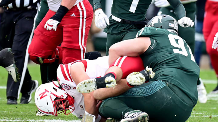 Nov 4, 2023; East Lansing, Michigan, USA;  Michigan State Spartans defensive lineman Maverick Hansen (97) sacks Nebraska Cornhuskers quarterback Heinrich Haarberg (10) in the first quarter at Spartan Stadium. Mandatory Credit: Dale Young-USA TODAY Sports