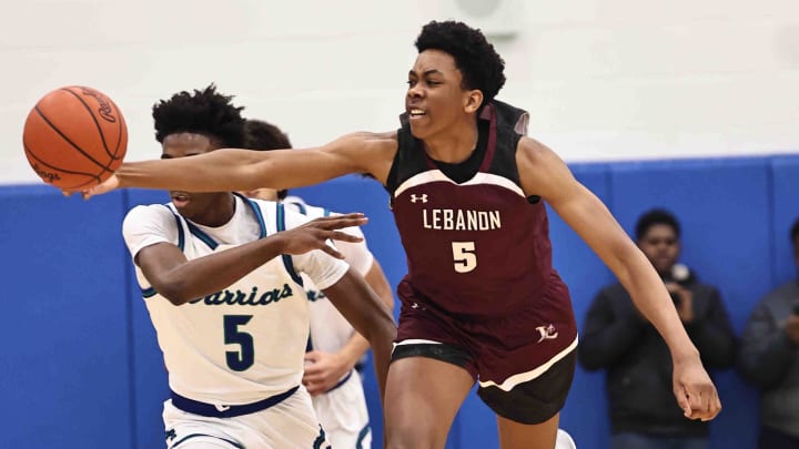 Lebanon forward Anthony Thompson (5) chases after a loose ball during their during their 50-61 loss to Winton Woods Friday, Jan. 5, 2024.