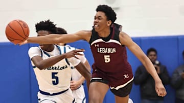 Lebanon forward Anthony Thompson (5) battles Winton Woods guard Nate Dawson (5) for a loose ball during their 50-61 loss Friday, Jan. 5, 2024.