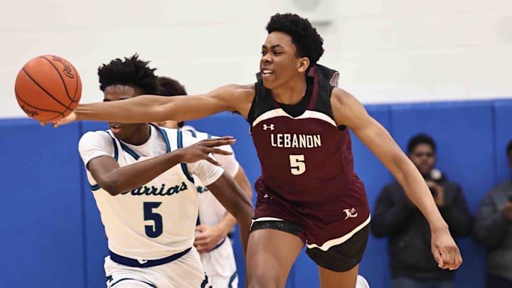 Lebanon forward Anthony Thompson (5) battles Winton Woods guard Nate Dawson (5) for a loose ball during their 50-61 loss Friday, Jan. 5, 2024. Lebanon forward Anthony Thompson (5) battles Winton Woods guard Nate Dawson (5) for a loose ball during their 50-61 loss Friday, Jan. 5, 2024.
