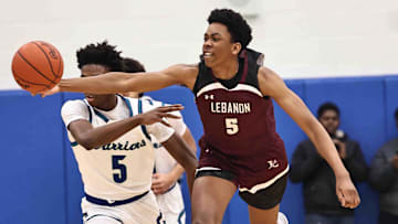 Lebanon forward Anthony Thompson (5) battles Winton Woods guard Nate Dawson (5) for a loose ball during their 50-61 loss Friday, Jan. 5, 2024.