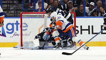 Mar 29, 2025; Tampa, Florida, USA; New York Islanders center Kyle Palmieri (21) shoots as Tampa Bay Lightning goaltender Jonas Johansson (31) makes a save during the second period at Amalie Arena. Mandatory Credit: Kim Klement Neitzel-Imagn Images